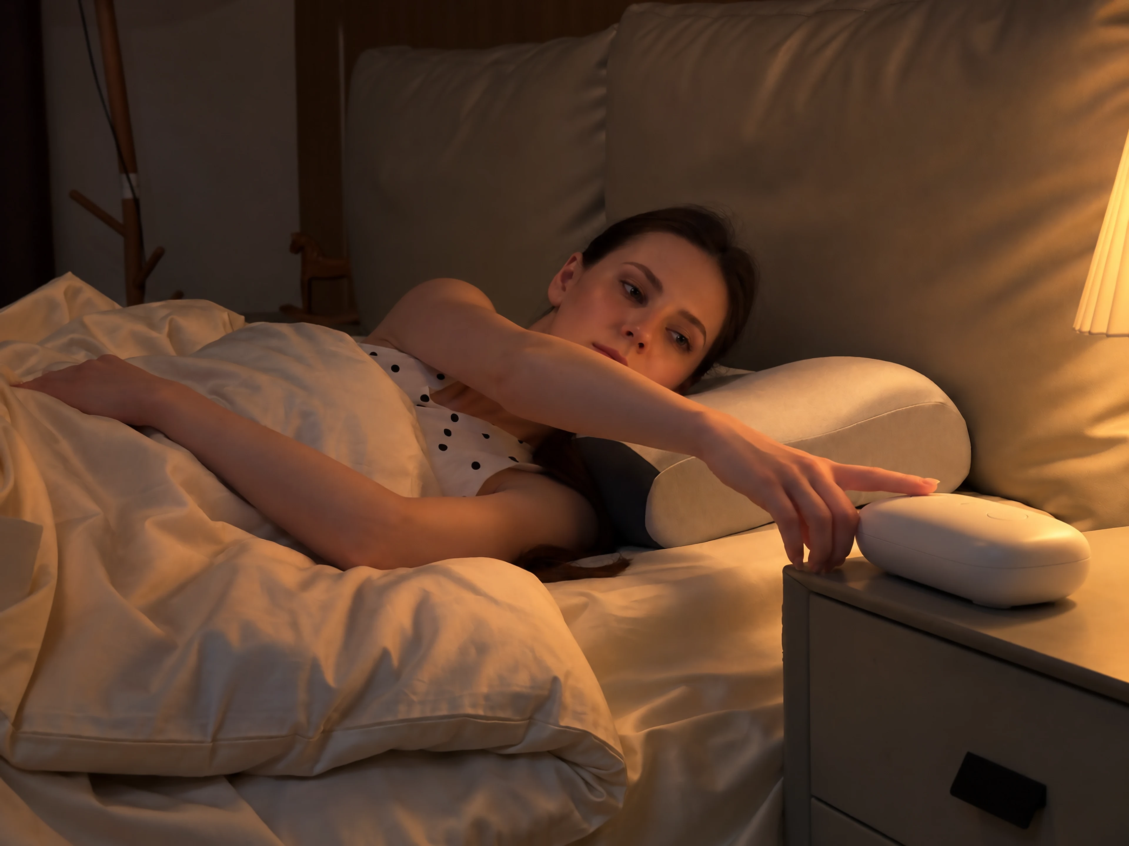 One-touch controller beside a Sleepria pillow at bedtime
